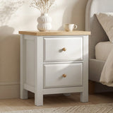 [White] Haven bedside table close front view in bedroom with vase and cup styled on natural oak top surface