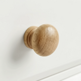 [White] Haven bedside table close-up of turned wooded round drawer knob with natural oak grain detail