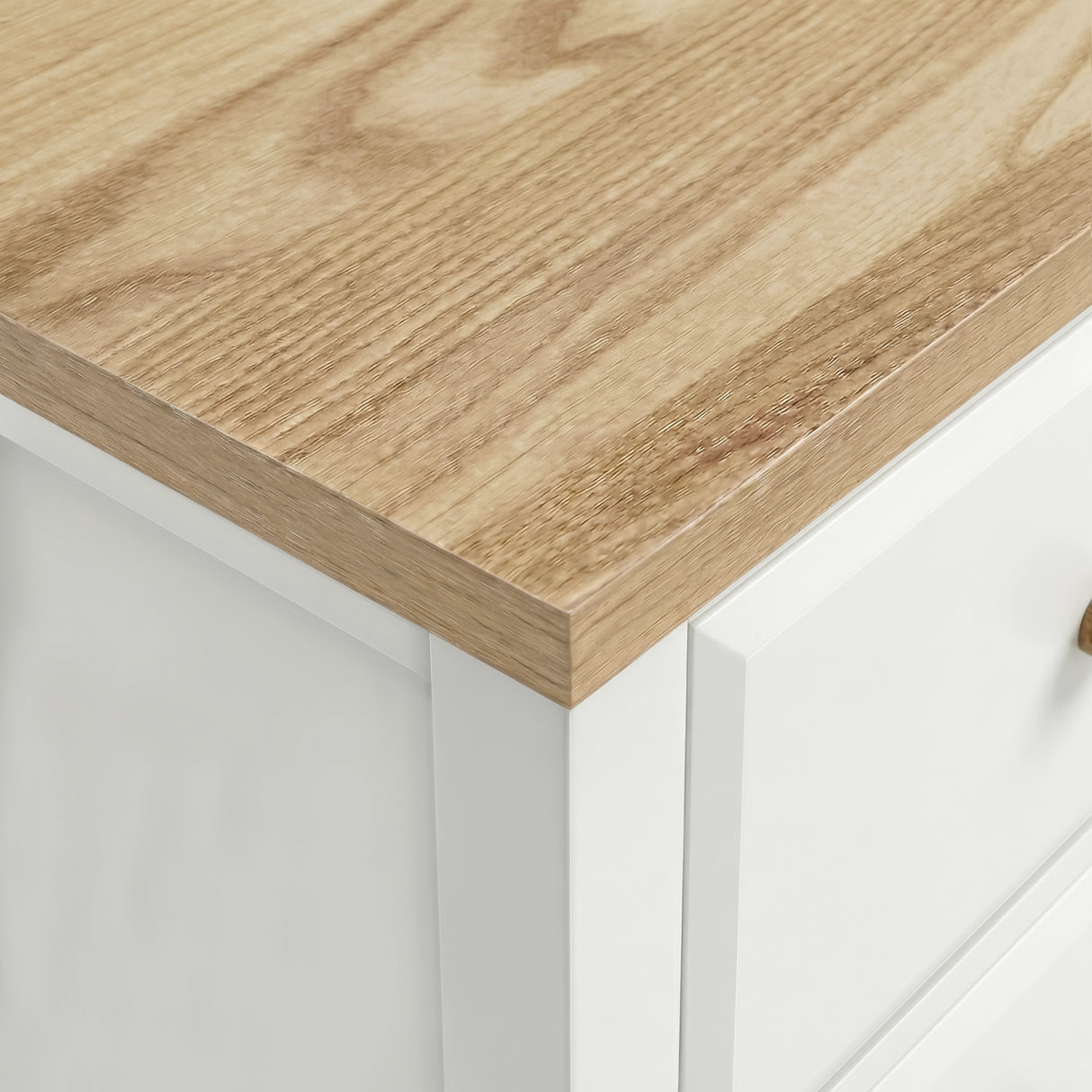 [White] Haven bedside table close-up of natural oak-effect top surface showing wood grain and white painted edge
