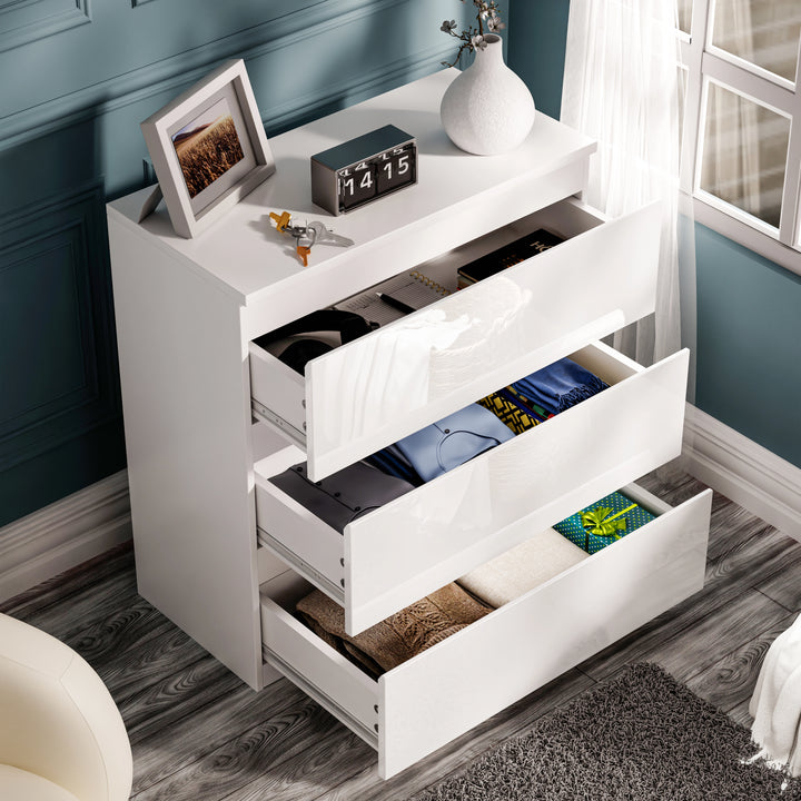 [White] Open white high gloss chest of drawers from the High Gloss 4 Piece Bedroom Set, displaying folded clothes and accessories
