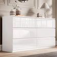 [White] High gloss 6 drawer chest of drawers in elegant bedroom with panelled wall and vases.