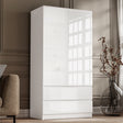 modern handleless white high gloss double wardrobe with drawers placed against a wall of an organised room