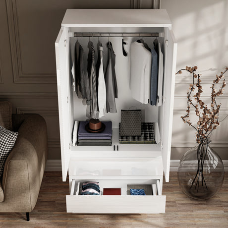 [White] high angle shot of an open white high gloss wardrobe showing clothes on the hanging rail and folded in the bottom drawers