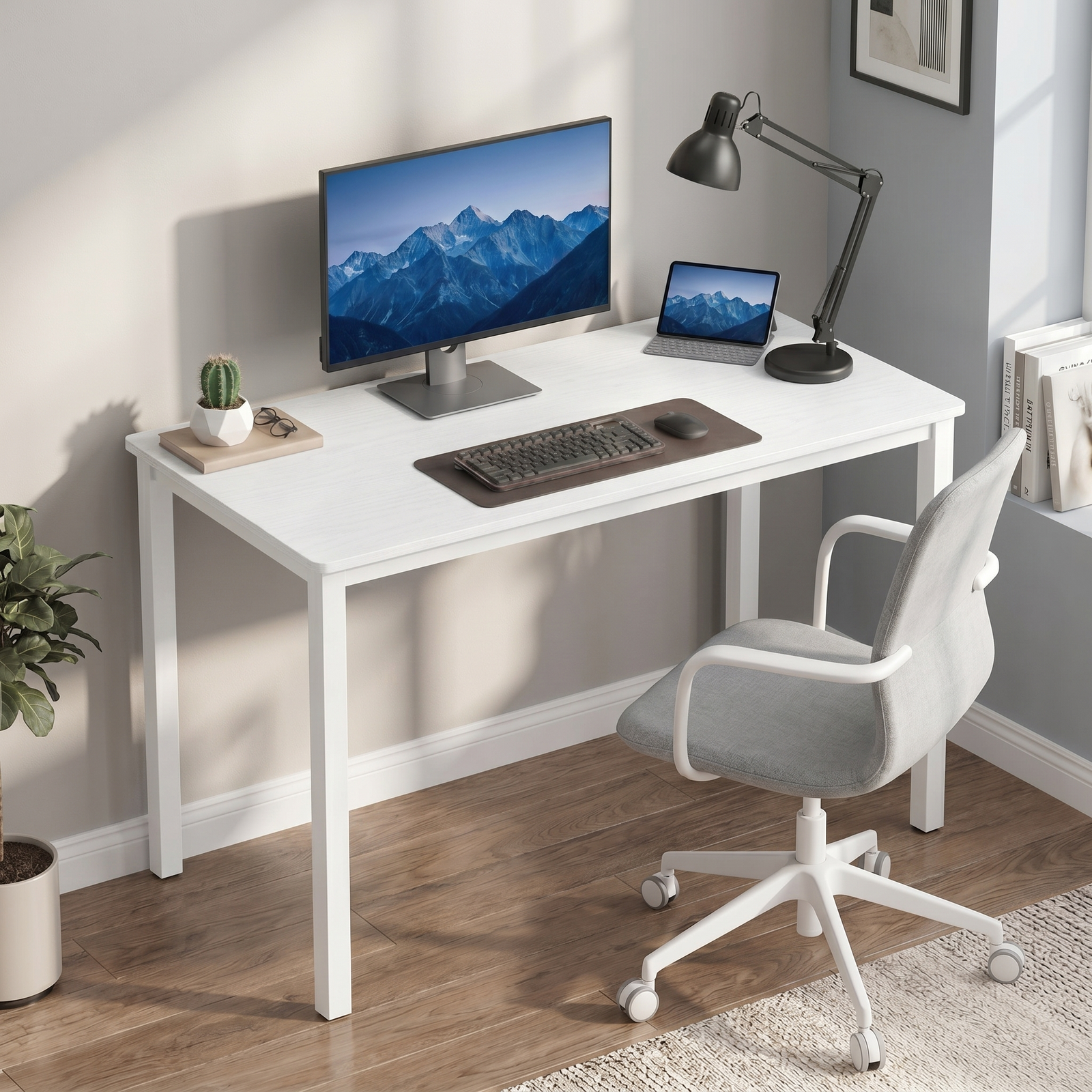 [100 x 50 cm] Home Office Desk 100cm angled in grey home office with monitor, tablet, keyboard, black lamp, cactus, and grey upholstered office chair on wood floor