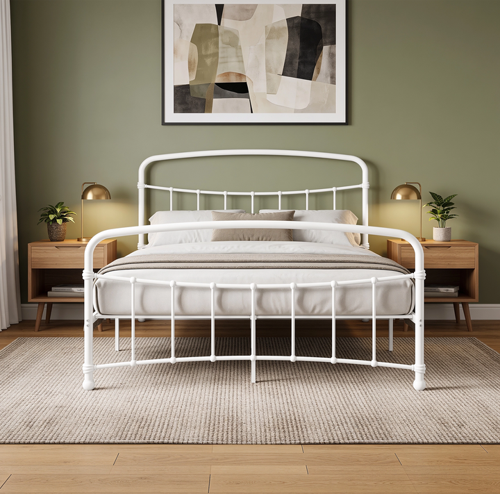 [White | King] Front view showing curved headboard and footboard rails, vertical bars, pillows, lamps, and bedside drawers.