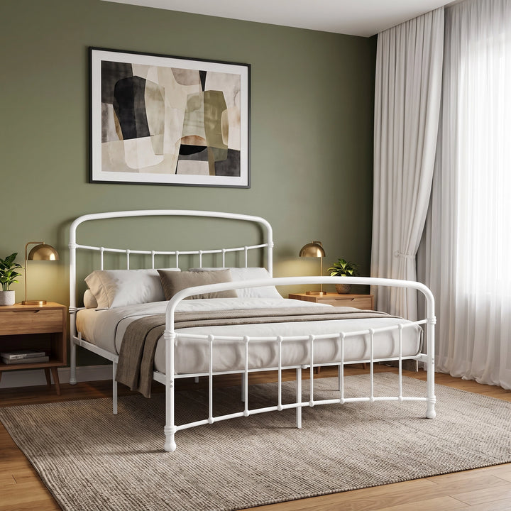 [White | King] Angled metal bed view showing curved rails, vertical bars, bedding, bedside lamps, curtains, and wall art.