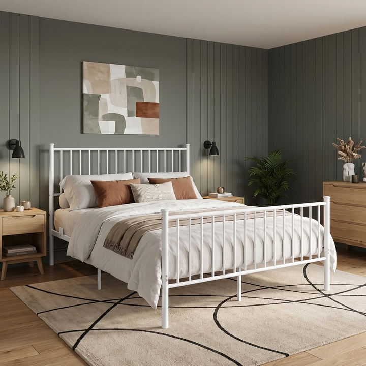 [White | King] Bedroom scene showing a metal bed, rust cushions, beige throw, wooden furniture, a plant, and patterned rug.