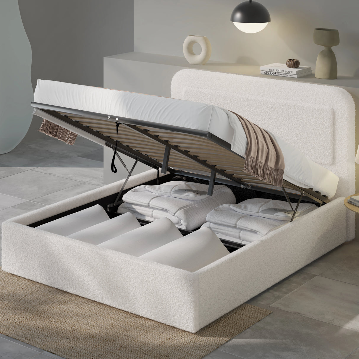 White upholstered bed with storage compartments in a modern bedroom setting.