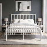 [White | King] Front view of metal bed with white-grey bedding, bar ends, centre leg, two bedside lamps and abstract wall art