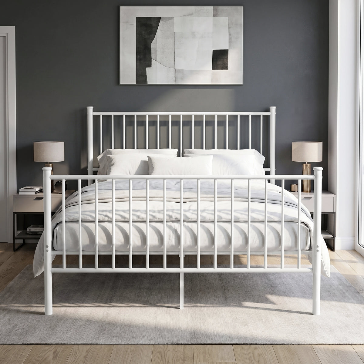 [White | King] Front view of metal bed with white-grey bedding, bar ends, centre leg, two bedside lamps and abstract wall art