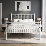 [White | King] Front view of metal bed with white-grey bedding, bar ends, centre leg, two bedside lamps and abstract wall art