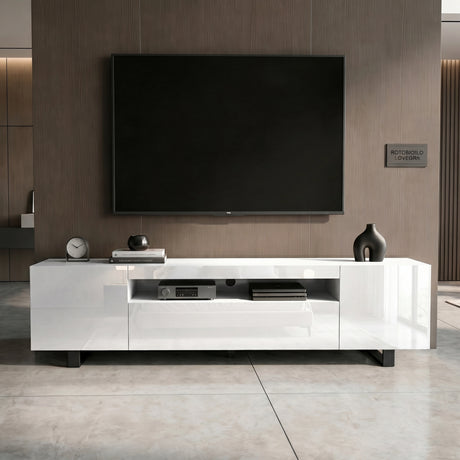 [White] Kystra TV unit facade view with handleless white doors, dark panel wall above and pale tile floor below