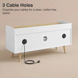 [White | 112 cm] Larvik rear panel showing three cable management holes with power cord threaded through on beige background