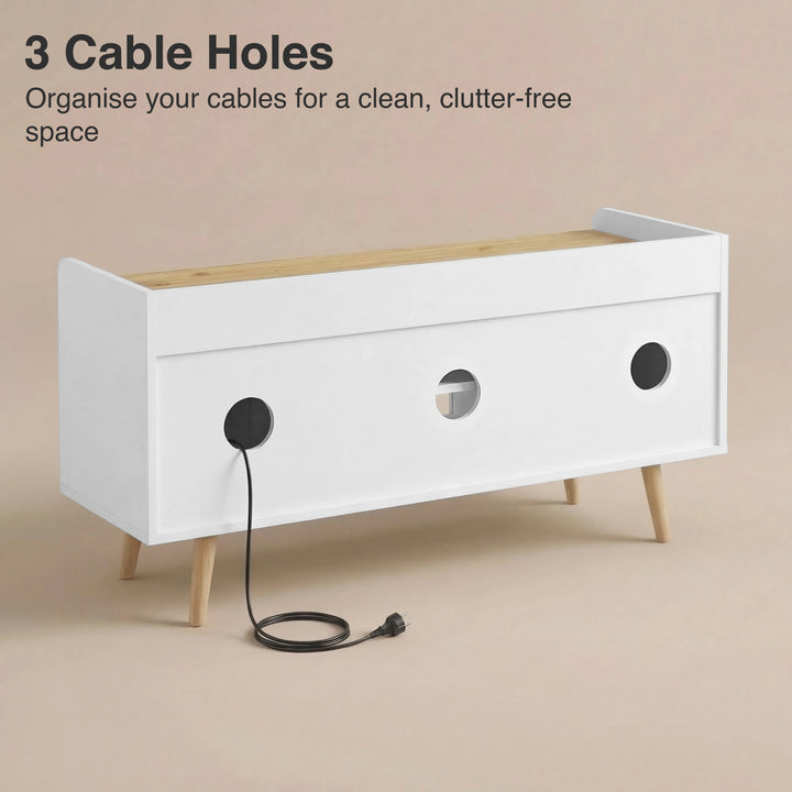 [White | 112 cm] Larvik rear panel showing three cable management holes with power cord threaded through on beige background