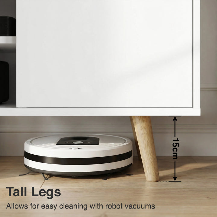 [White | 112 cm] Larvik close-up of 15cm tapered oak legs with robot vacuum passing underneath on wooden floor in grey-toned room