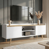 [White] Larvik White TV Unit with Shelves styled against a dark grey panelled wall with a TV above, open centre shelving, two side cabinets and tapered oak legs