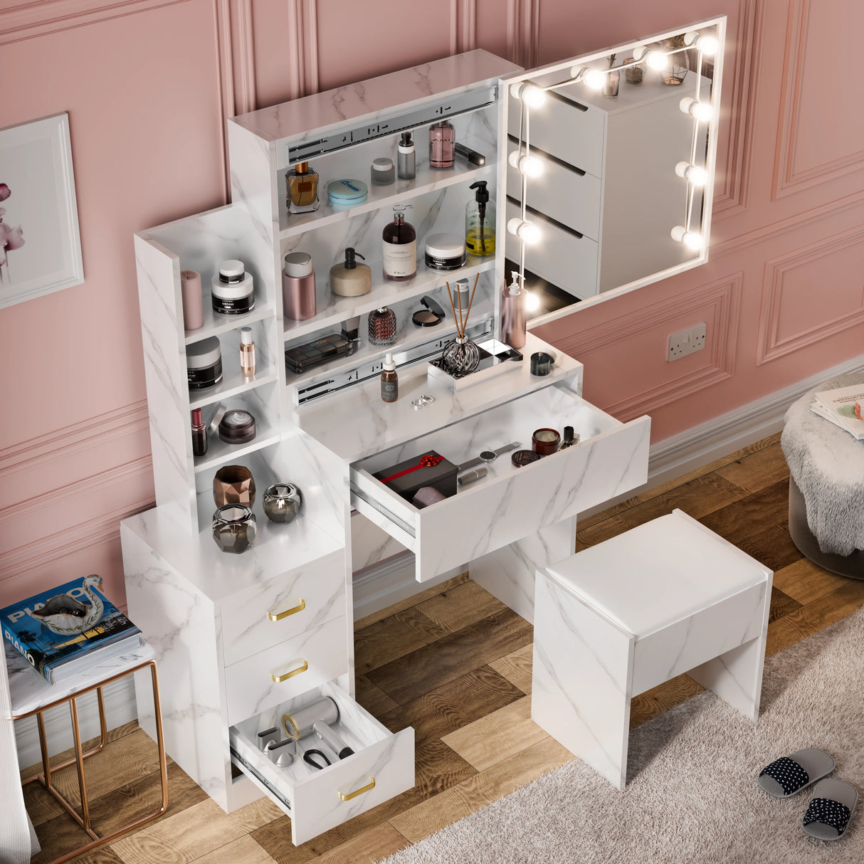 White vanity table with mirror and storage compartments in a room with pink walls.
