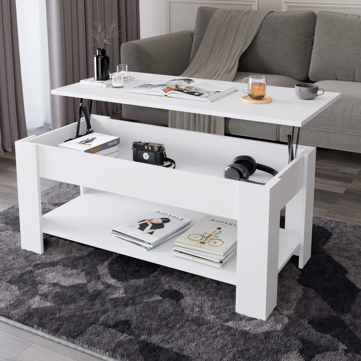 [White] Lift top coffee table open in styled living room with grey sofa and dark rug.