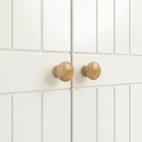 [White] cabinet doors with wooden knobs on a white tiled wall background