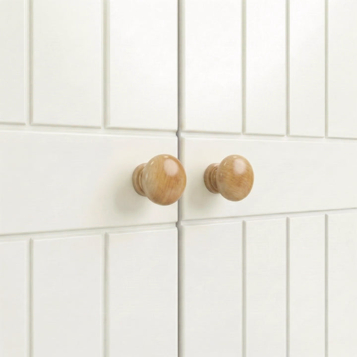 [White] cabinet doors with wooden knobs on a white tiled wall background