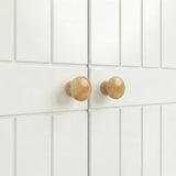 [White] Linra 2 Door Wardrobe close-up of grooved door fronts showing paired round oak knob handles against matte white finish