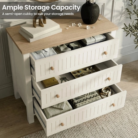 [White] Open drawers on the Linra bedroom furniture set chest, oak top styled with vase and books above