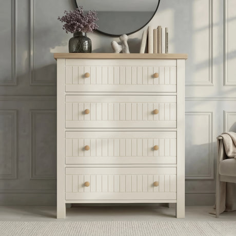 [White] Linra 4 drawer chest front view with oak top, round wood knobs, vase and books below round mirror