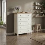 [White] Linra tall 5 drawer chest in a styled living space against a grey wall with a stool on wooden floor