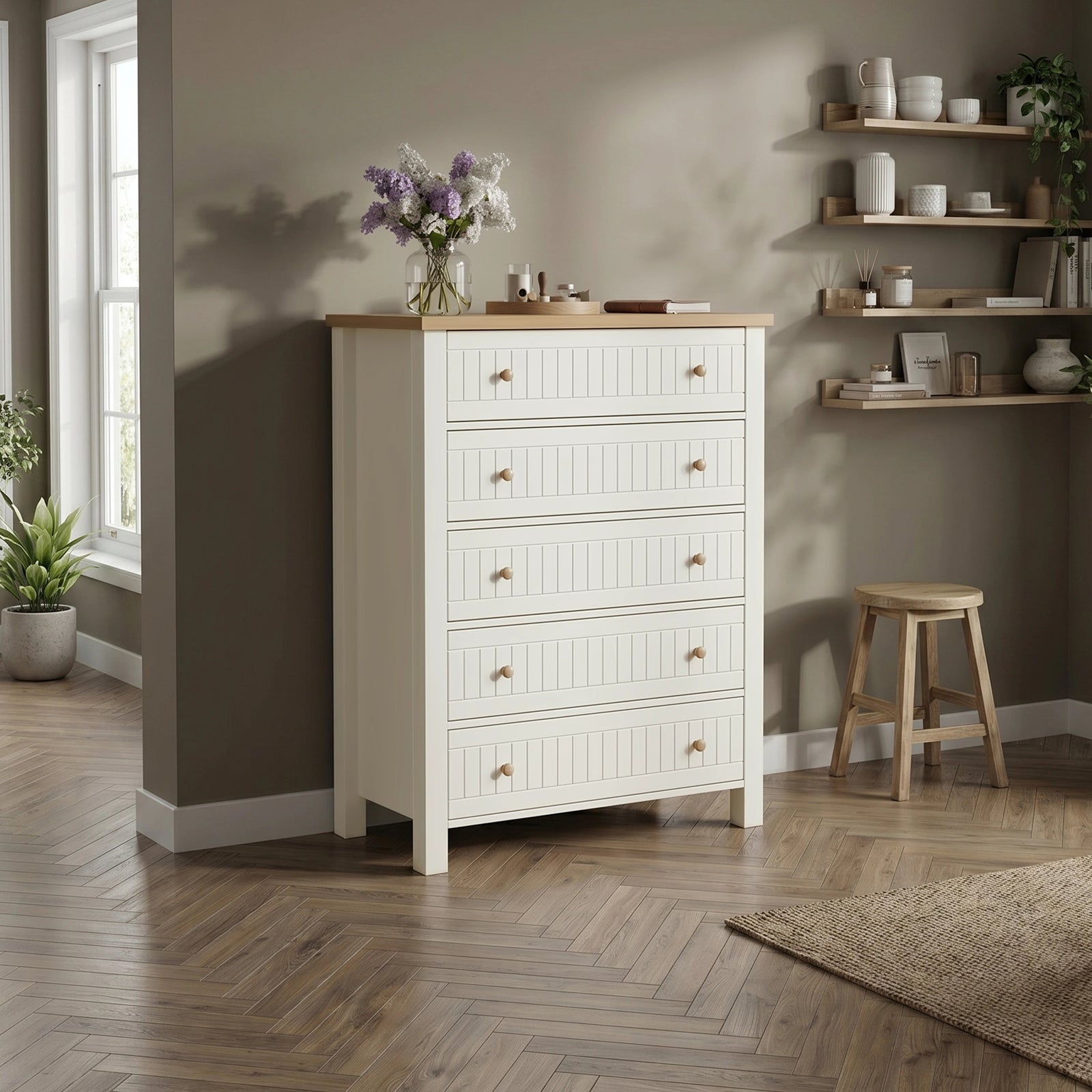 [White] Linra tall 5 drawer chest in a styled living space against a grey wall with a stool on wooden floor