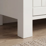 [White] Linra large 6 drawer chest base detail, tapered white leg lifting cabinet above oak flooring