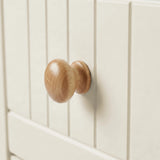 [White] Linra chest of drawers close-up of natural oak rounded wooden knob on grooved painted drawer front