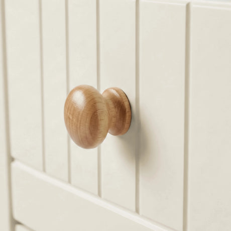 [White] Linra chest of drawers close-up of natural oak rounded wooden knob on grooved painted drawer front