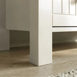 [White] Linra chest of drawers leg detail showing white painted post meeting drawer rail and floor