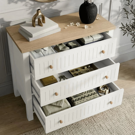 [White] Linra 3-drawer chest of drawers with drawers open highlighting ample storage capacity and oak top