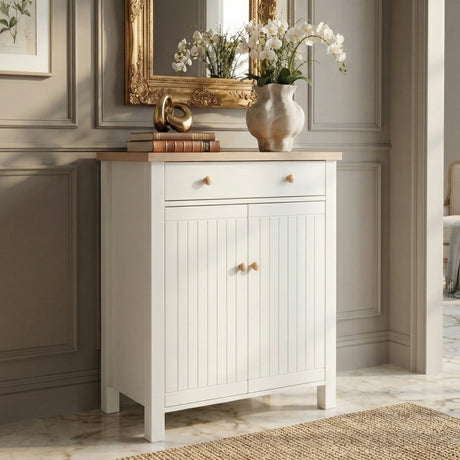[White] Linra shoe cabinet with oak top, top drawer, and grooved double doors styled in a classic hallway with gold mirror