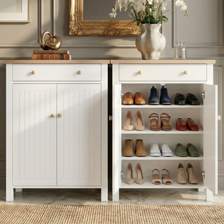 [White] Linra shoe cabinet shown closed and open side by side, interior displaying four shelves with heels, loafers, and trainers