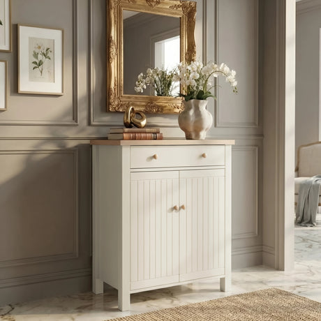 [White] Linra shoe cabinet front view with oak top, single drawer, tongue-and-groove doors, and round wood knobs styled in elegant hallway setting