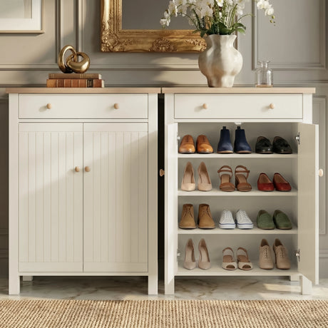 [White] Linra shoe cabinet shown side by side closed and open, with four shelves storing heels, flats, and trainers in a marble-floored hallway