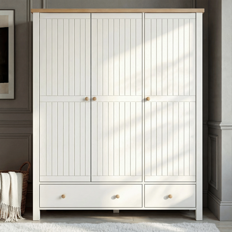 [White] Linra 3-door wardrobe with closed tongue and groove panelled doors in a bright lifestyle bedroom