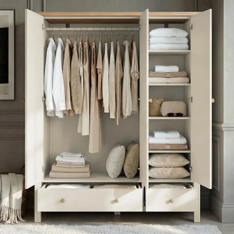 [White] Open interior of the Linra bedroom furniture set wardrobe, clothes on rail left, folded linens on shelves