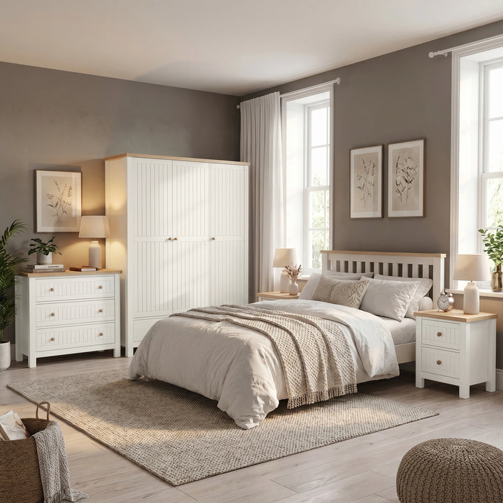 [White] Linra Painted 4 Piece Bedroom Furniture Set styled in a complete bedroom with wardrobe, chest of drawers, bed, and bedside tables
