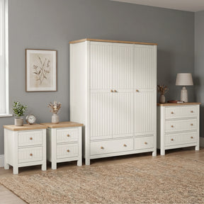 [White] Linra Painted 4 Piece Bedroom Furniture Set showing triple wardrobe, chest of drawers, and two bedside tables with oak tops
