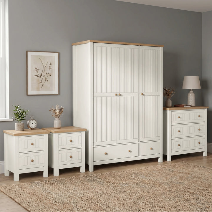 [White] Linra Painted 4 Piece Bedroom Furniture Set showing triple wardrobe, chest of drawers, and two bedside tables with oak tops