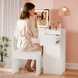 Woman applying makeup in front of a white vanity mirror with a pink wall and plant in the background.