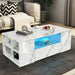 Elegant white marble coffee table with LED lighting and storage shelves for modern living room