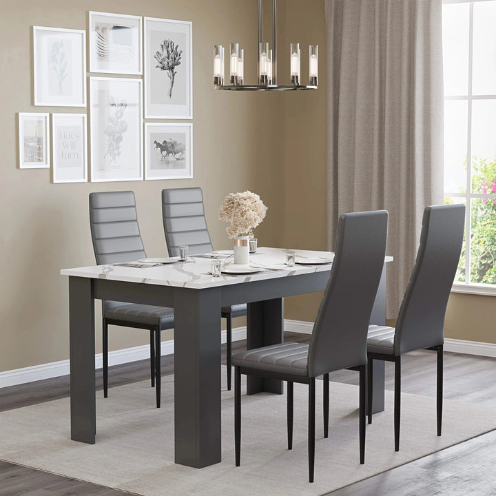 [4 Seater | Grey] dining table and chairs set in neutral room with marble top and four grey PU chairs