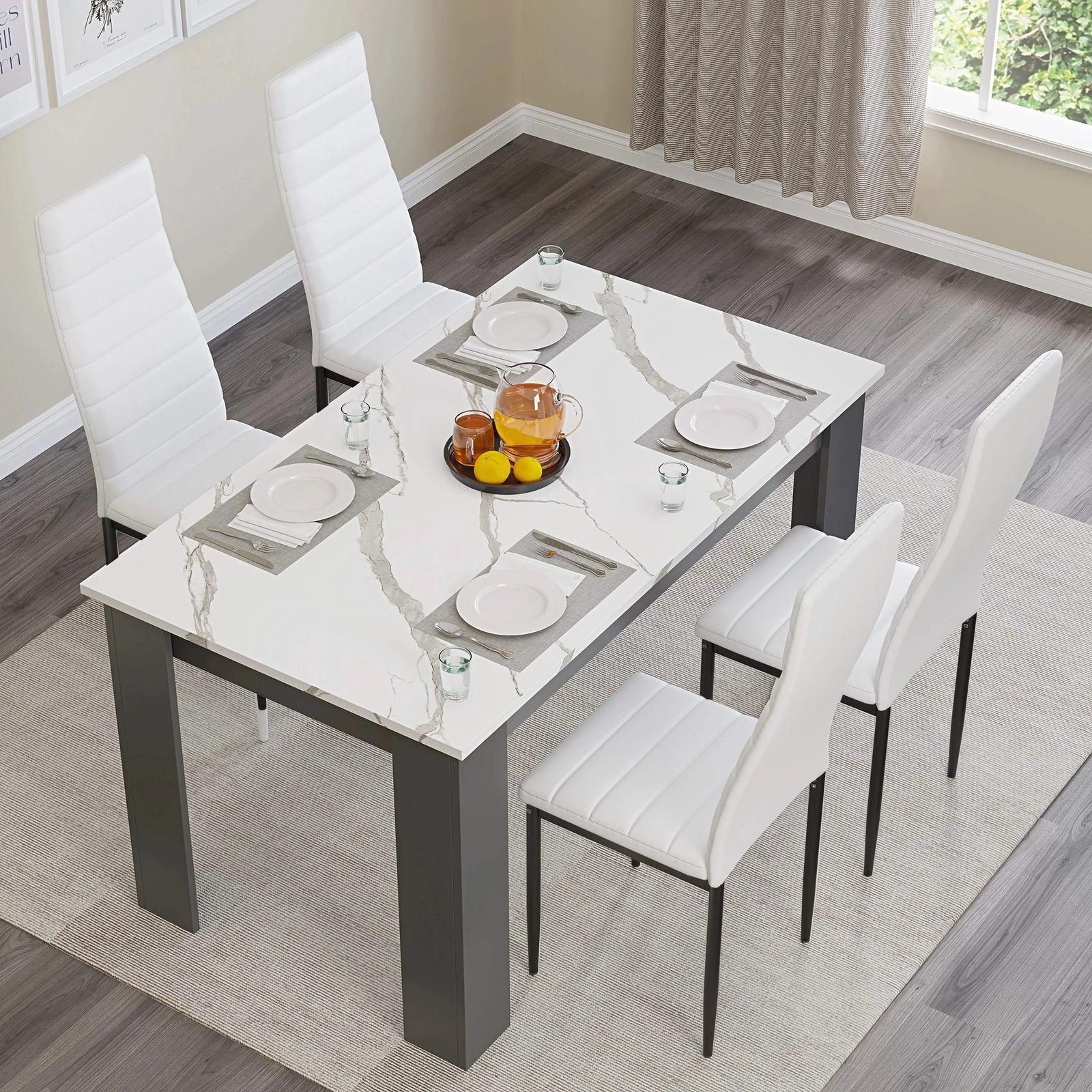 [4 Seater | White] overhead shot of marble dining table with four white chairs and central bowl of fruit