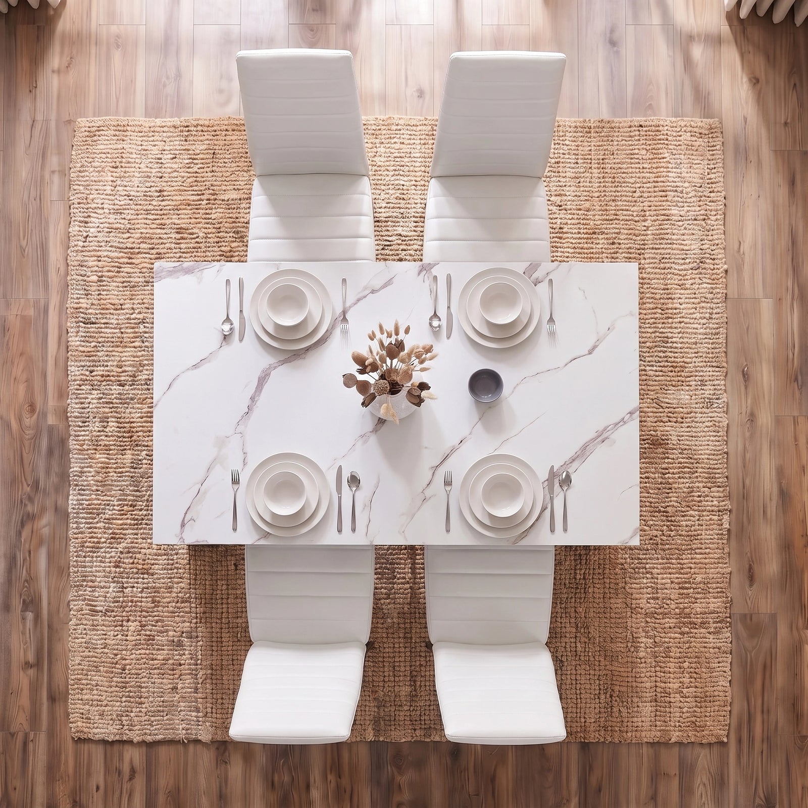 [4 Seater | White] overhead shot of marble dining table with four white chairs and plates setting