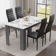 modern small dining table and chairs set featuring white marble top with grey base and black chairs