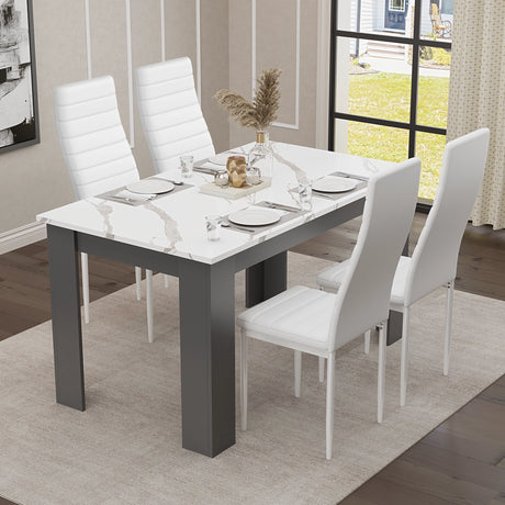 marble white dining room tables sets paired with grey chairs in a bright, contemporary dining room
